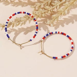 Bohemian large hoop earrings with colorful red white blue seed beads on gold wire