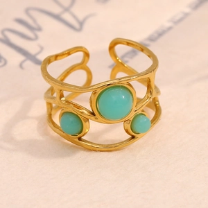 Detail of 18K gold plated stainless steel ring with three green turquoise stones
