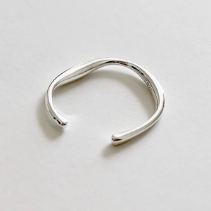 Macro view of solid 925 sterling silver ring showing the 925 hallmark and curved design