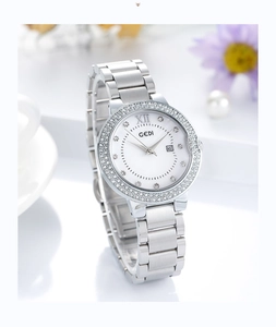 Detail view of GEDI silver quartz watch with diamond bezel and pearl white dial face