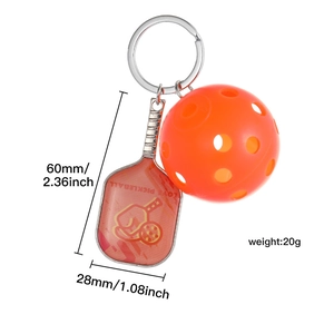 Detail view of orange pickleball keychain with racquet size 60x28mm weighing 20g