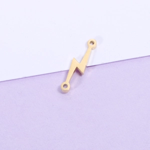 Polished gold lightning bolt connector charm with dual attachment loops on a bicolor base