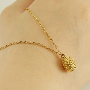 18k gold plated stainless steel durian pendant necklace worn on neck