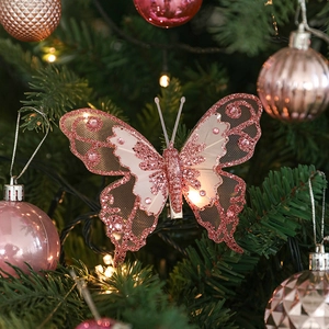 Papillon de Noël rose pailleté pour sapin avec ailes en résille et cristaux décoratifs