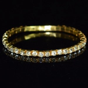 Macro detail of gold stretch bridal bracelet with multiple rows of sparkling crystals