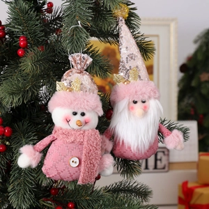 Pink sequin knit Christmas tree ornaments with snowman and Santa Claus designs