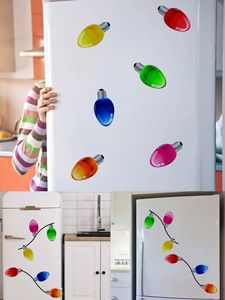Detail of colorful magnetic bulb decals and black wire stickers on a white refrigerator