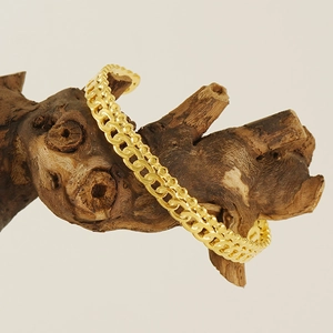 Bracelet gourmette tissé en acier inoxydable plaqué or 18 carats sur bois décoratif