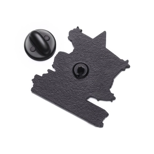 Detail view of the black enamel pin back with matte texture and rubber clutch
