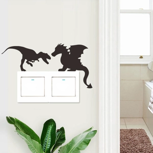 Black dinosaur silhouette wall stickers decorating a double light switch panel on white wall