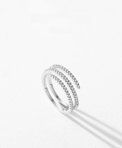 Macro detail of a triple-layer S925 silver ring featuring pave-set sparkling zirconia