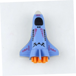 Detailed top view of a blue toy space shuttle with orange thrusters and graphic prints