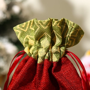 Christmas drawstring gift bag with cartoon character and red textured woven fabric