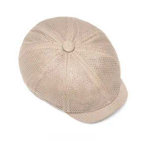 Detailed top view of breathable beige mesh newsboy cap with honeycomb texture and top button