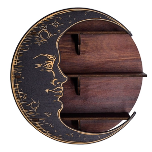 Detailed view of bohemian moon shelf with crescent face carving and wood grain tiers