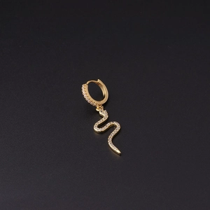 Detailed view of a gold-plated snake earring with micro-pave cubic zirconia on black background