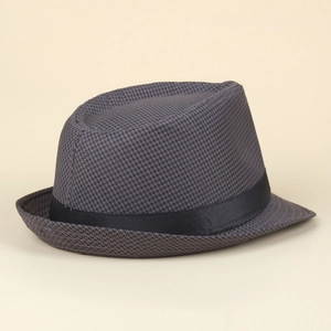 Detailed view of grey houndstooth fedora with black ribbon band on a neutral background