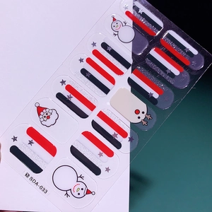 Détail des stickers ongles Noël SDA-033 avec motifs Père Noël, bonhomme de neige et étoiles