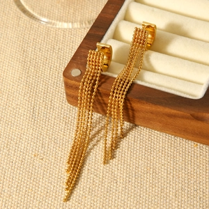 Elegant gold stainless steel hoop earrings with delicate beaded chain tassels on jewelry box