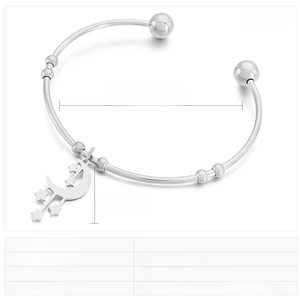 Detailed view of stainless steel open bangle with moon and star charm sizing and parameters
