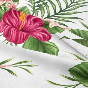 Detail of tropical hibiscus and palm leaf print on white bohemian tapestry fabric