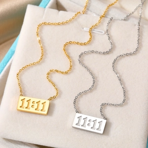 Minimalist 11:11 stainless steel bar necklaces in gold and silver finish on velvet