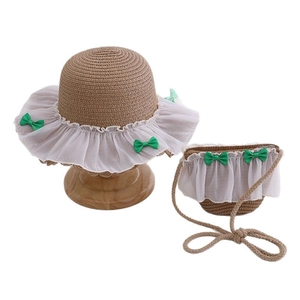 Children's straw sun hat and matching bag set with white lace trim and green bows