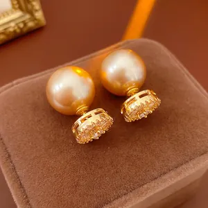 French vintage gold plated pearl earrings with zircon inlay on luxury velvet jewelry box