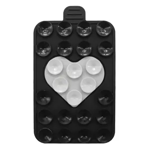 Detail view of rectangular silicone phone suction pad with white heart pattern