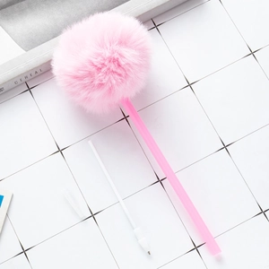 Cute pink fuzzy pom pom ballpoint pen with extra refill on a minimalist grid background