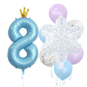Blue number 8 foil balloon with crown and snowflake decorations for 8th birthday party