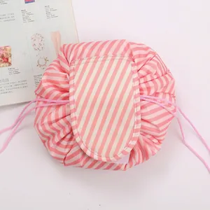 Pink striped drawstring makeup bag organizer with velcro flap closure for travel
