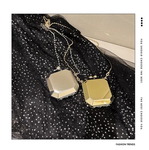Octagonal metallic mirror evening clutch bag in gold and silver with chain strap
