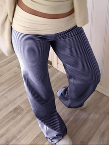 Blue striped flare pants with a beige fold-over waistband for a casual vacation look