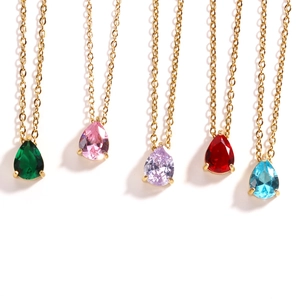 Detailed row of golden birthstone necklaces featuring colorful teardrop zircon pendants