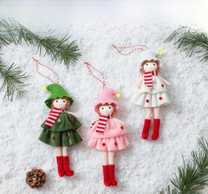 Detail of Christmas girl doll pendants in forest green pink and cream tulle cake dresses