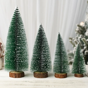 Miniature cedar Christmas trees with snow effect and wooden base in four sizes