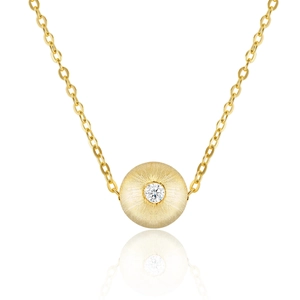 Detailed macro view of gold-finished drop pendant with brushed texture and center diamond