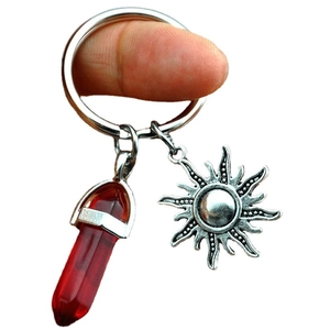 Natural red crystal column keychain with silver sun pendant on a large metal ring