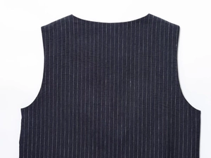 Detailed view of the back shoulder and collar on a dark blue striped linen vest