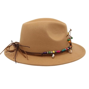 Detailed shot of camel wool fedora hat with colorful beads and shell trim
