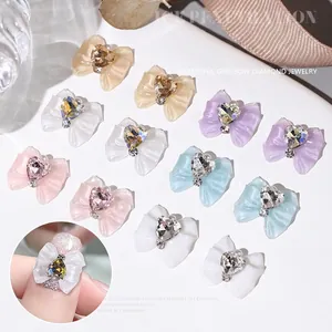 Japanese translucent resin bow nail charms with crystal heart accents in pastel colors
