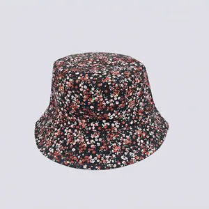 Detailed view of floral bucket hat featuring colorful patterns on dark canvas fabric