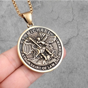 Close-up of Saint Michael pendant in bronze finish with law enforcement text engraving