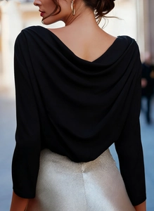Detail of elegant black V-neck backless draped blouse with sleek glossy fabric texture