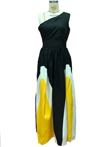Detail of color-block contrast pattern on a sleek one-shoulder slim-fit maxi dress