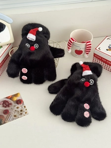 Detail of plush black snowman mittens with red holiday hats and festive button accents