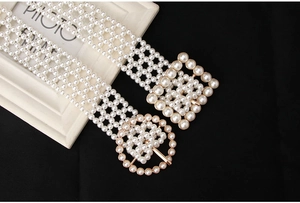 Close-up of pearl bead belts with gold-framed square and round metal buckles