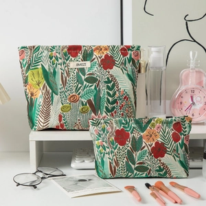 Detailed view of floral embroidery patterns on jacquard fabric toiletry bags