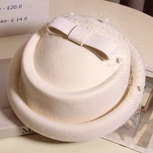 Elegant French vintage wool pillbox hat with bow and mesh veil in cream white
